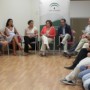 La directora general de Economía Social y Emprendedores y el director provincial en Huelva durante el encuentro con los emprendedores